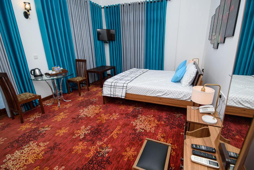 Postel nebo postele na pokoji v ubytování Royal Blu