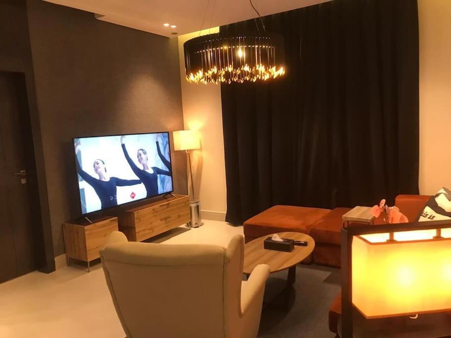 TV a/nebo společenská místnost v ubytování Dana Hotel Residence1