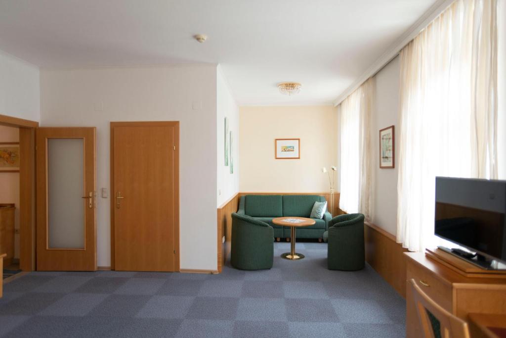 Televízia a/alebo spoločenská miestnosť v ubytovaní Fleger Appartements