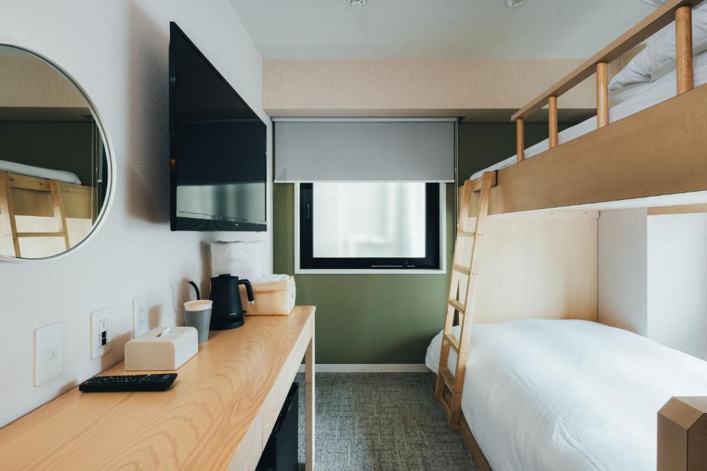Postel nebo postele na pokoji v ubytování MEANDER Osaka