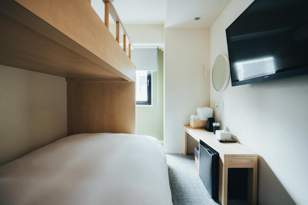 Postel nebo postele na pokoji v ubytování MEANDER Osaka