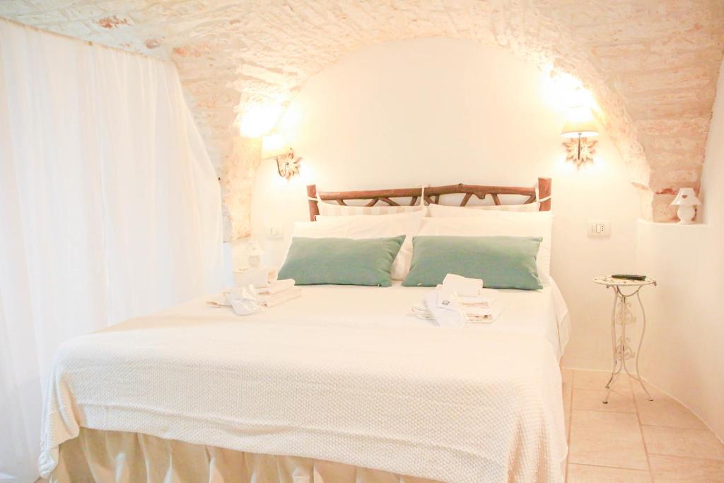 Postel nebo postele na pokoji v ubytování La casa di Nife by In Puglia service