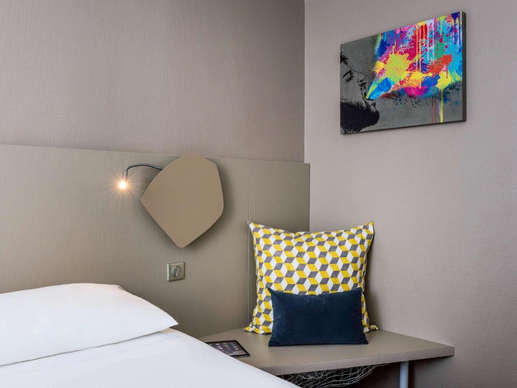 Un ou plusieurs lits dans un hébergement de l'établissement ibis Styles Paris Bercy
