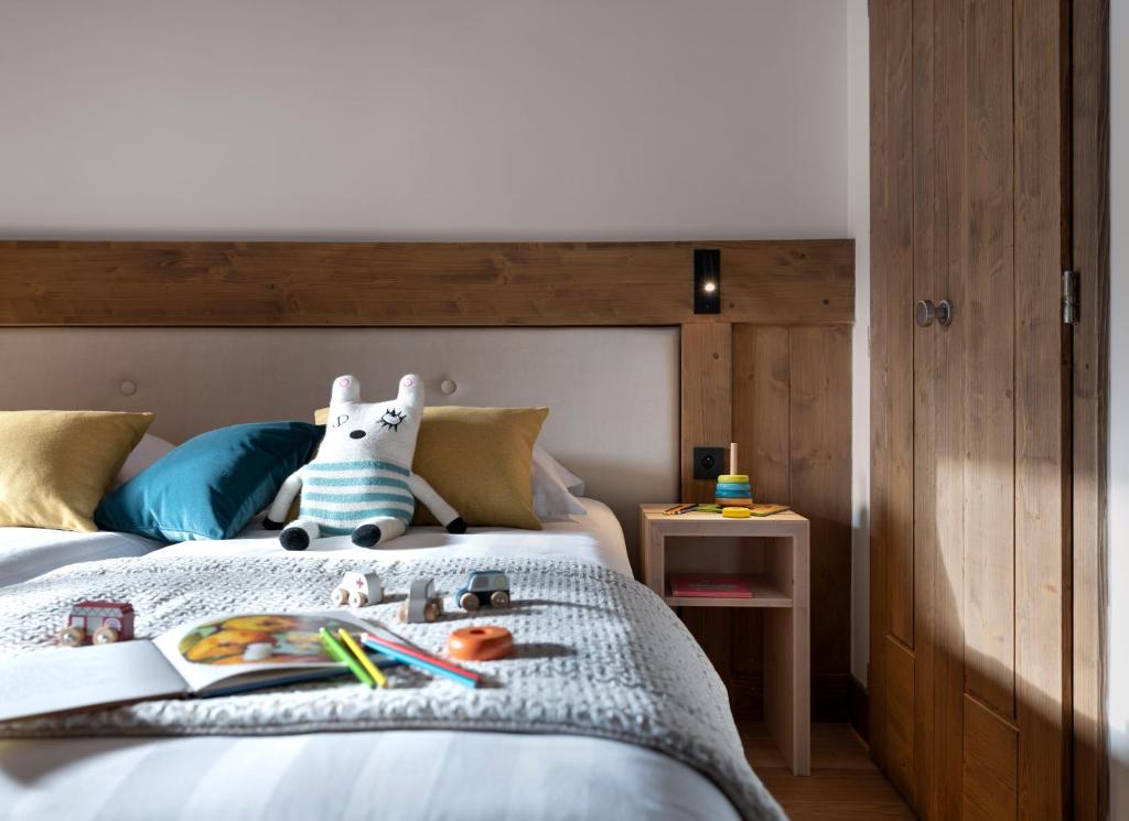Postel nebo postele na pokoji v ubytování MGM Hôtels & Résidences - Hôtel Laska