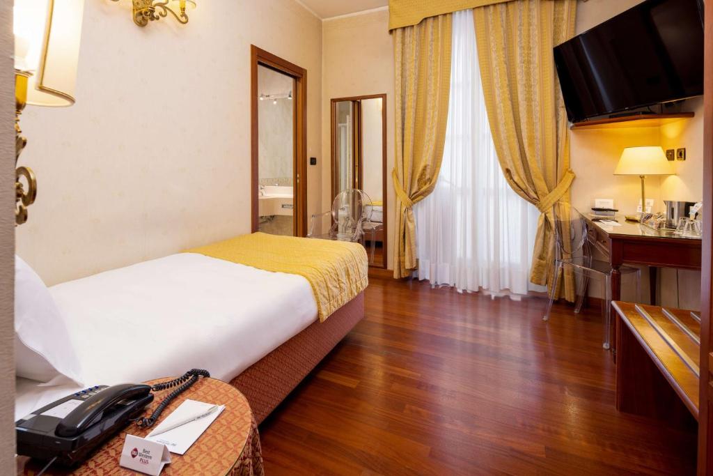 TV a/nebo společenská místnost v ubytování Best Western Plus Hotel Genova