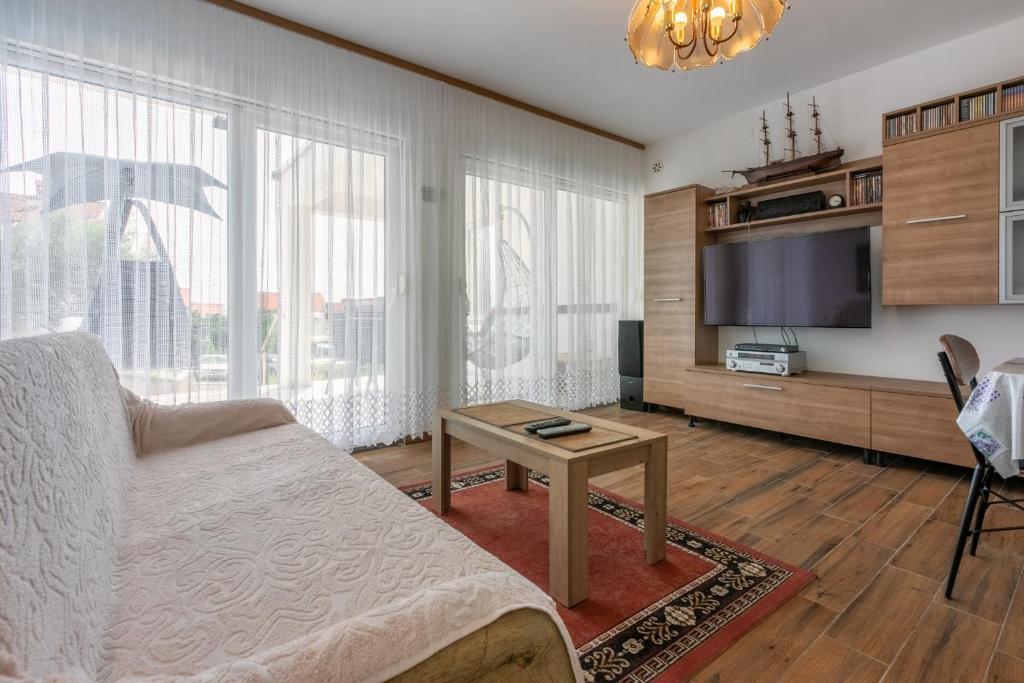 TV a/nebo společenská místnost v ubytování Milano