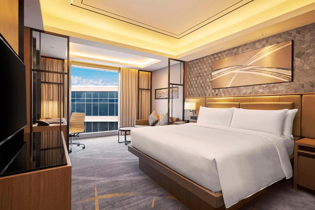 Postel nebo postele na pokoji v ubytování Hilton Manila