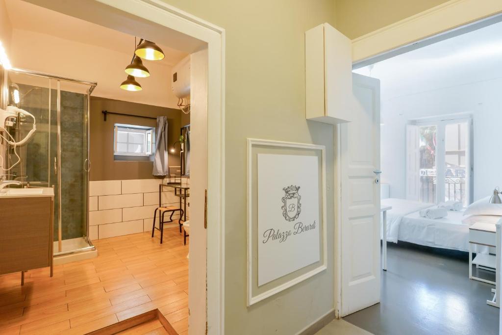 A bed or beds in a room at Palazzo Berardi
