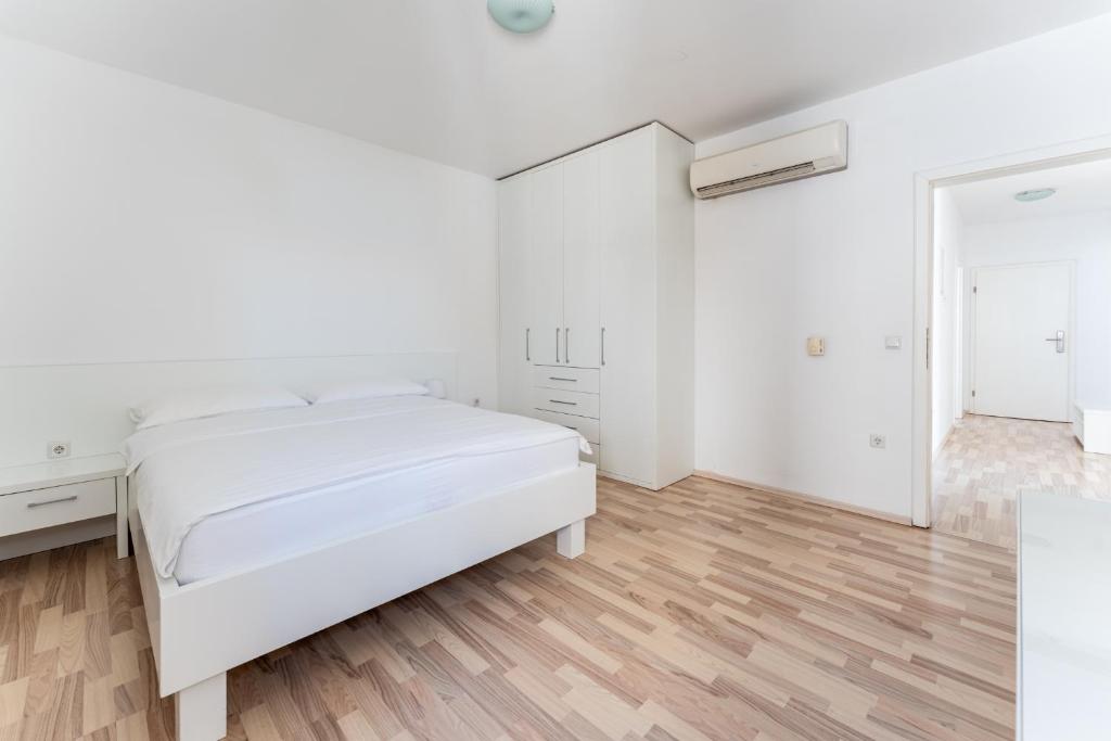Postel nebo postele na pokoji v ubytování Apartments Barbati