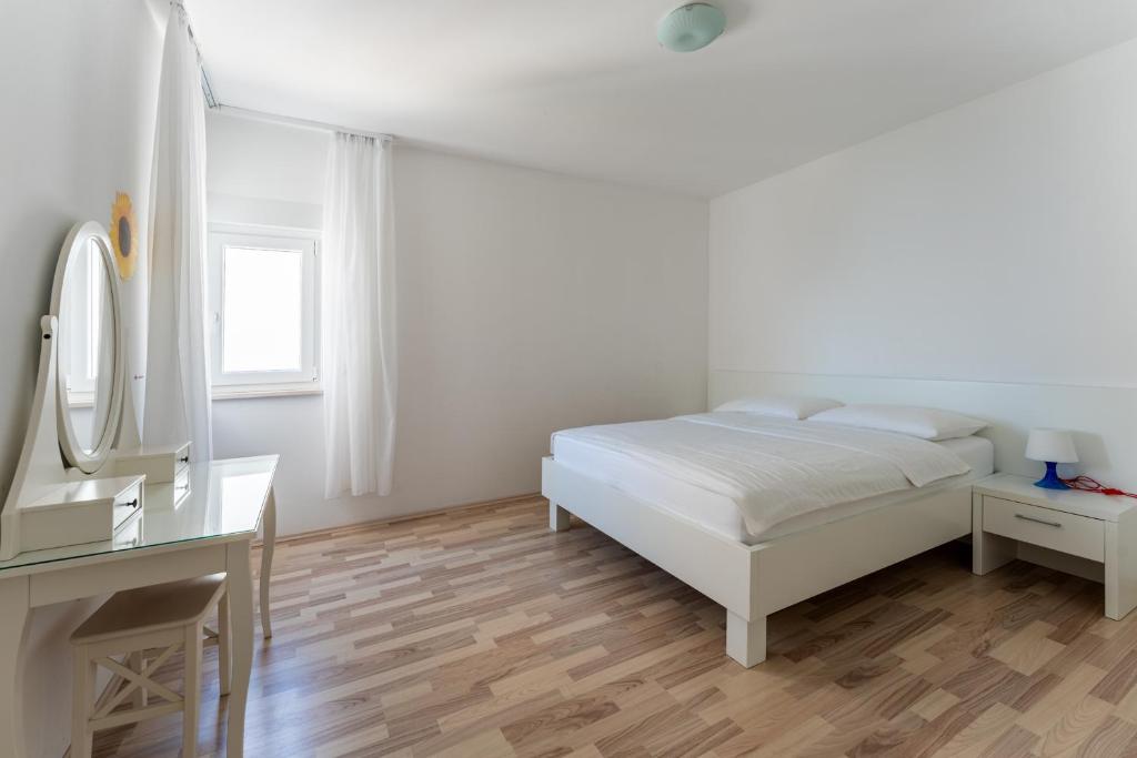 Postel nebo postele na pokoji v ubytování Apartments Barbati
