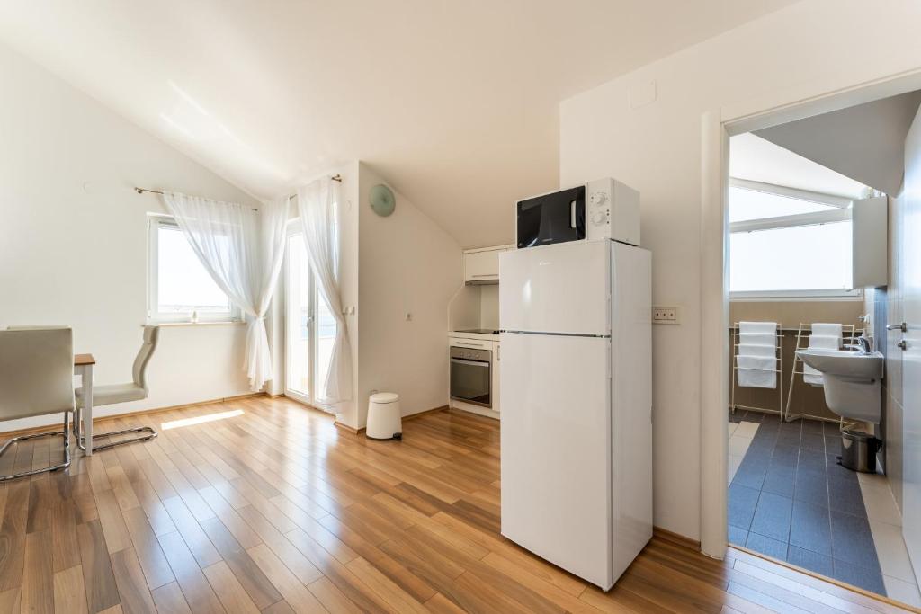 Kuchyň nebo kuchyňský kout v ubytování Apartments Barbati