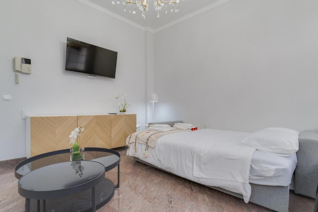 Postel nebo postele na pokoji v ubytování Funchal City Nest I