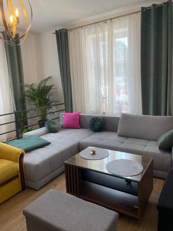 a living room with a couch and a coffee table at Kłodzka 30 in Lądek-Zdrój