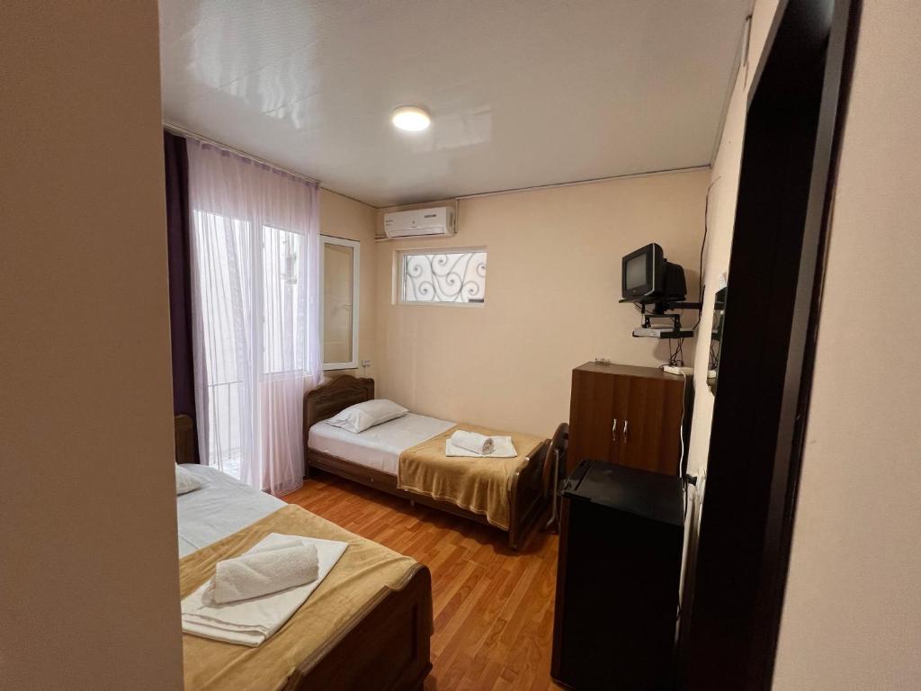 Postel nebo postele na pokoji v ubytování Imeri Hotel