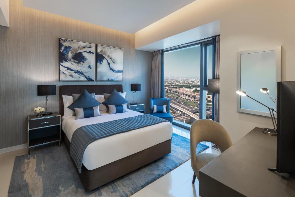 DAMAC Maison Aykon City Dubai客房内的一张或多张床位