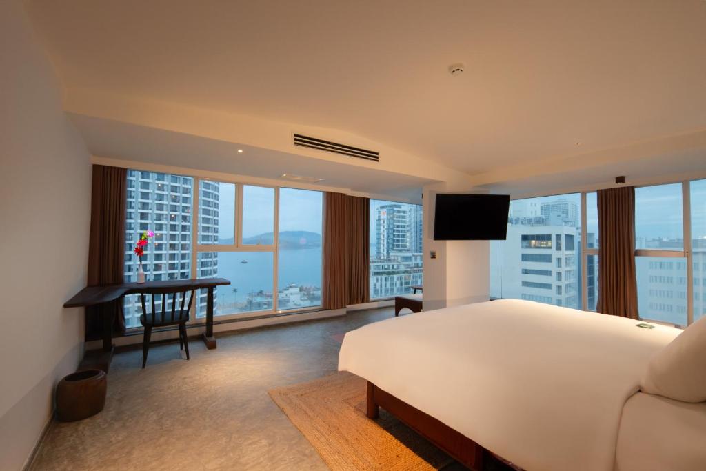 Postel nebo postele na pokoji v ubytování Green World Hotel Nha Trang