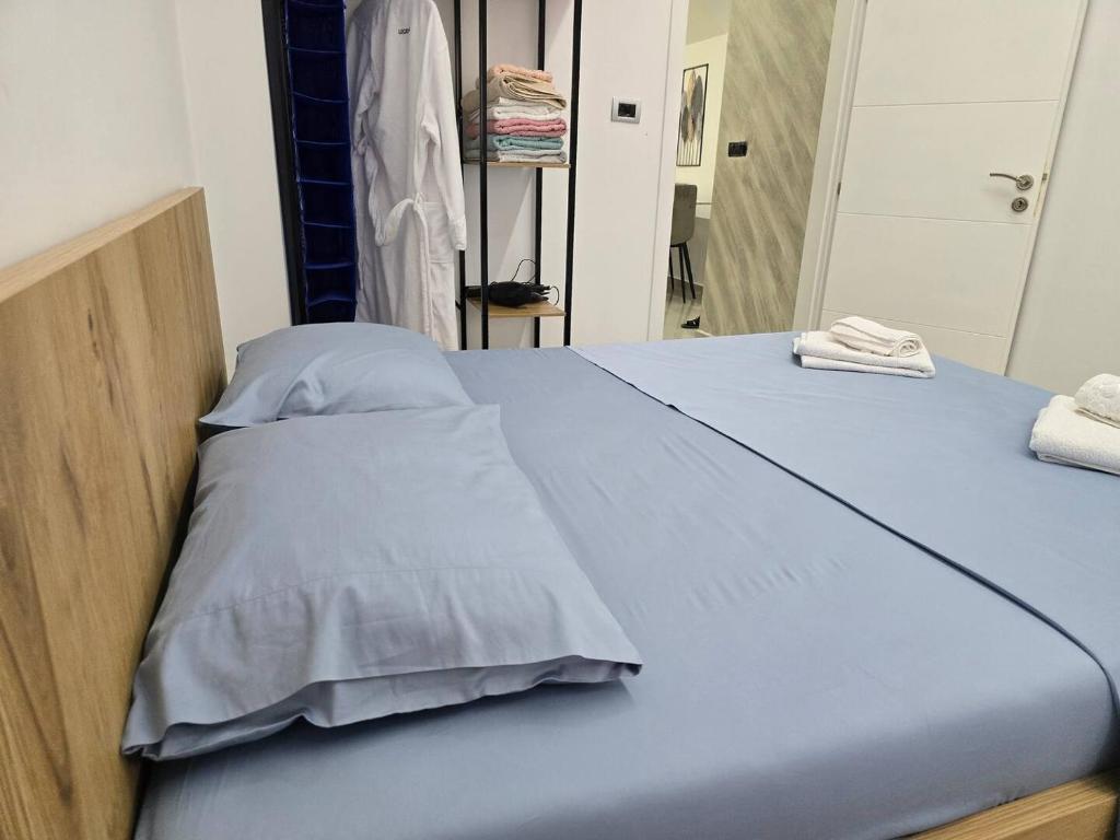 Postel nebo postele na pokoji v ubytování Duka Apartment