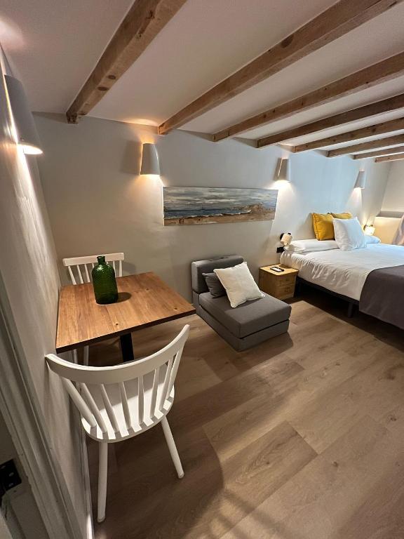 Postel nebo postele na pokoji v ubytování Calendula Hotel & Apartaments