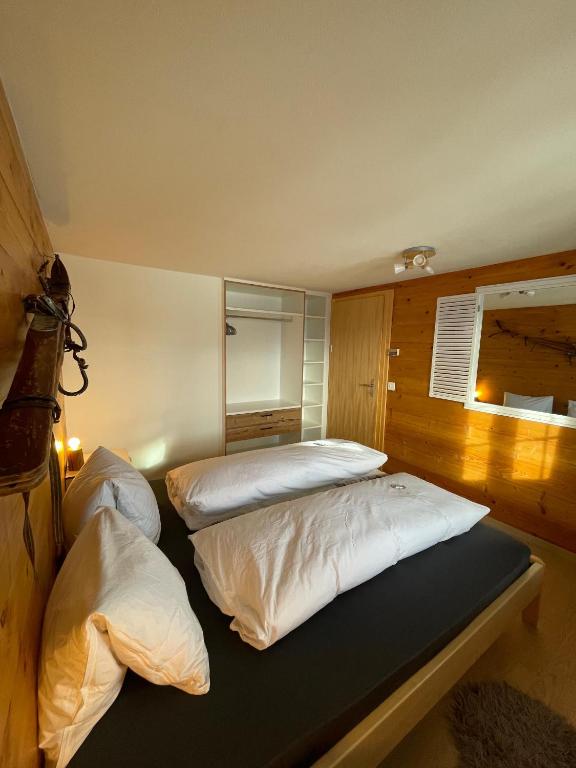 Una cama o camas en una habitación de Chalet La Montanara