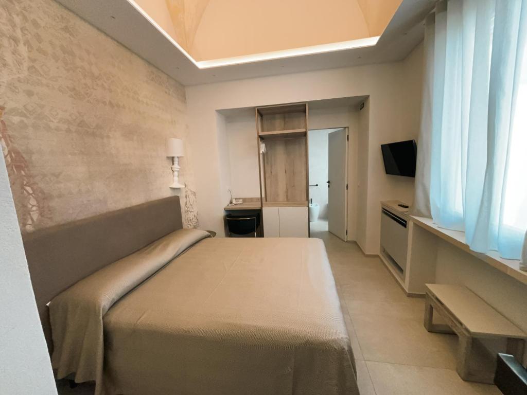 TV a/nebo společenská místnost v ubytování Palazzo Arco Cadura Hotel & Spa