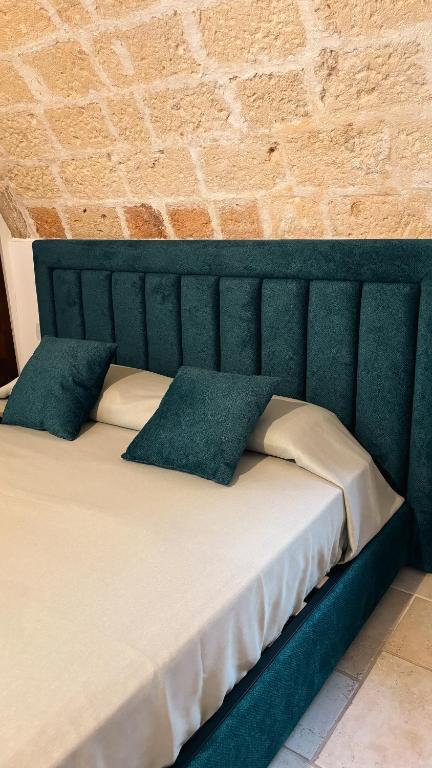 Postel nebo postele na pokoji v ubytování Palazzo Arco Cadura Hotel & Spa