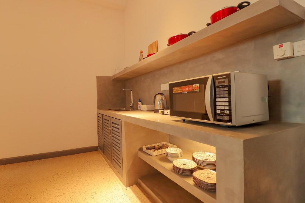 Kuchyň nebo kuchyňský kout v ubytování Wonmi Residency