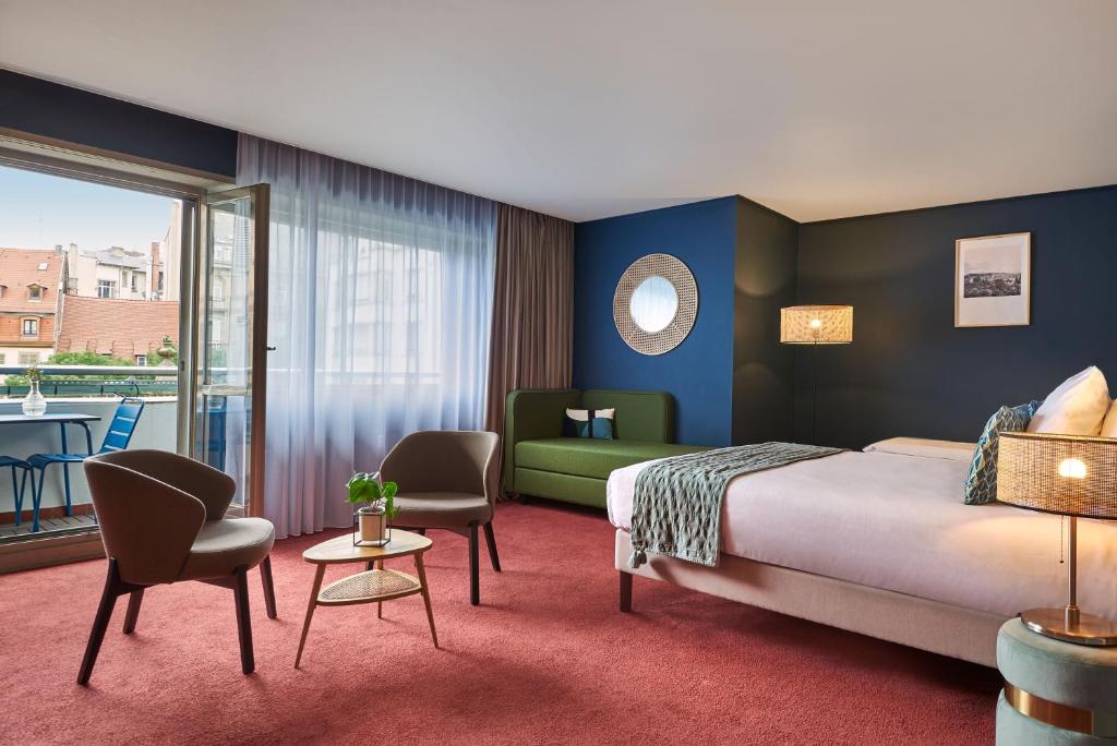 Postel nebo postele na pokoji v ubytování Hotel Kaijoo by HappyCulture