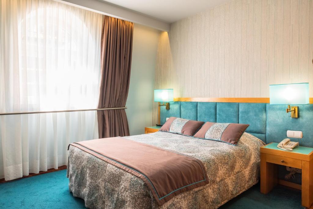 Postel nebo postele na pokoji v ubytování Hotel Boa - Vista
