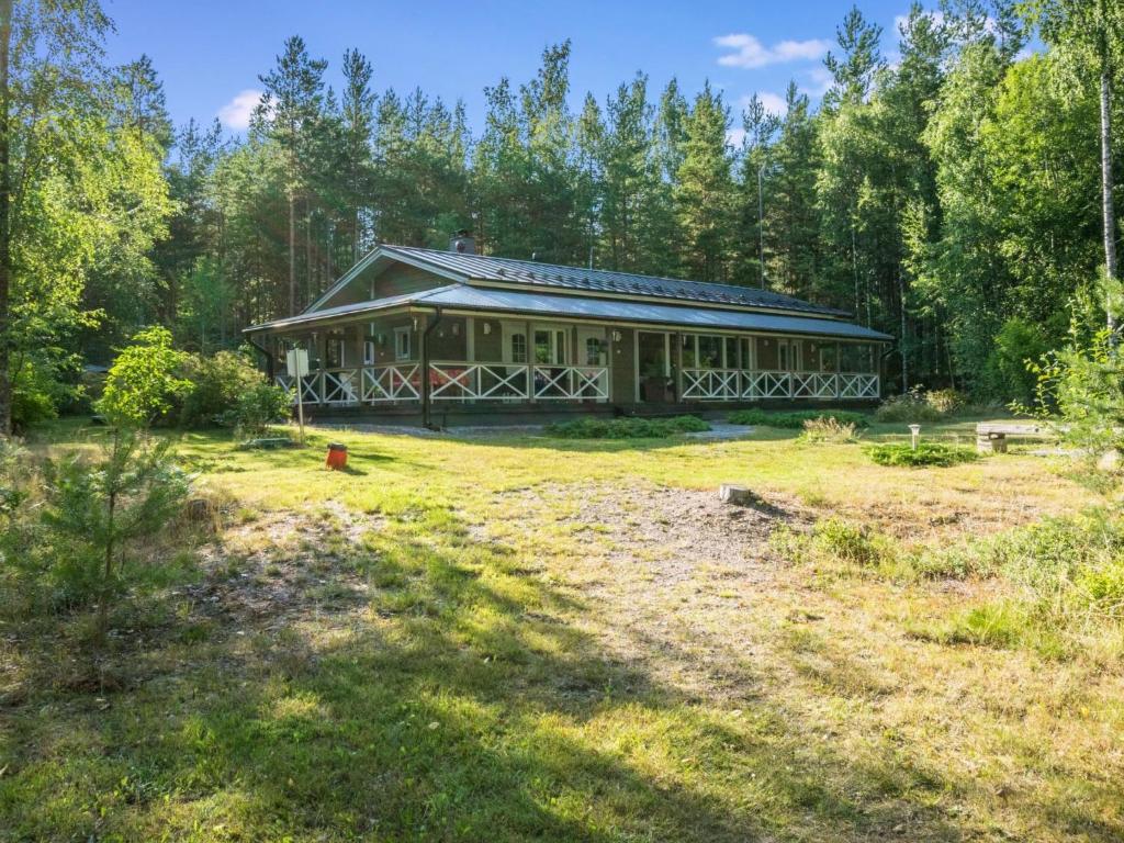 a large house in the middle of a field at Holiday Home Villa blombacka by Interhome in Isnäs