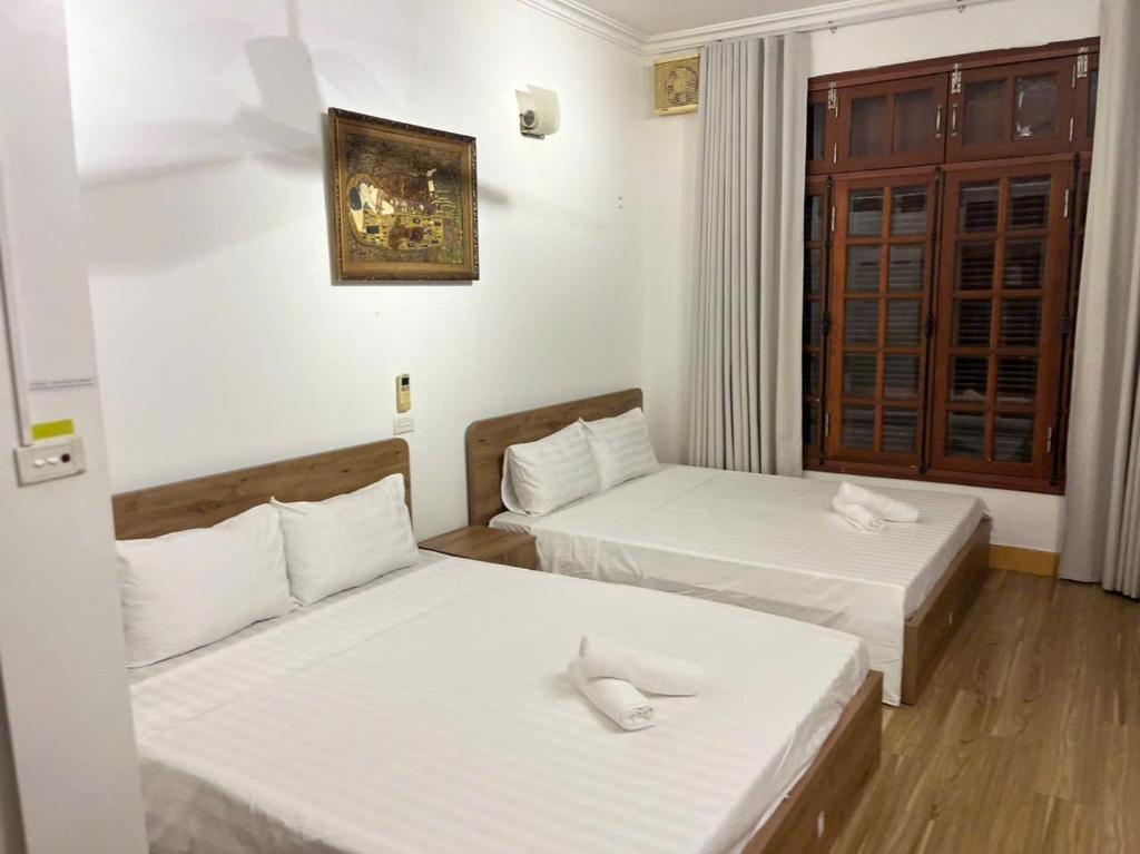 Postel nebo postele na pokoji v ubytování fortuna homestay