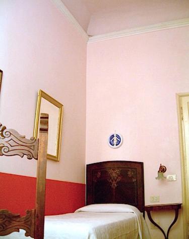 Postel nebo postele na pokoji v ubytování Hotel Cestelli