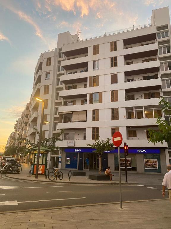 a large white building on a city street at Casa de Huespedes el Almendro in Ibiza Town