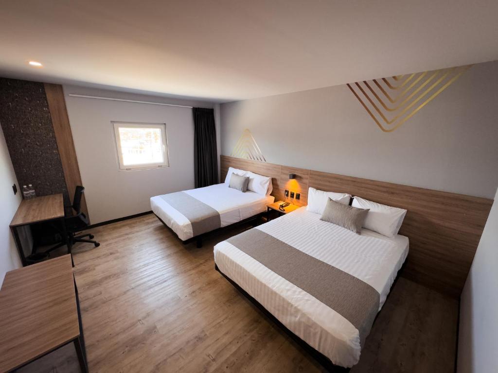 Postel nebo postele na pokoji v ubytování Avanta Hotel & Villas Querétaro