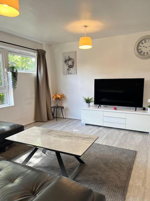 a living room with a flat screen tv at Fabulous 1Bed Apt with Balcony in Central Birmingham in Birmingham