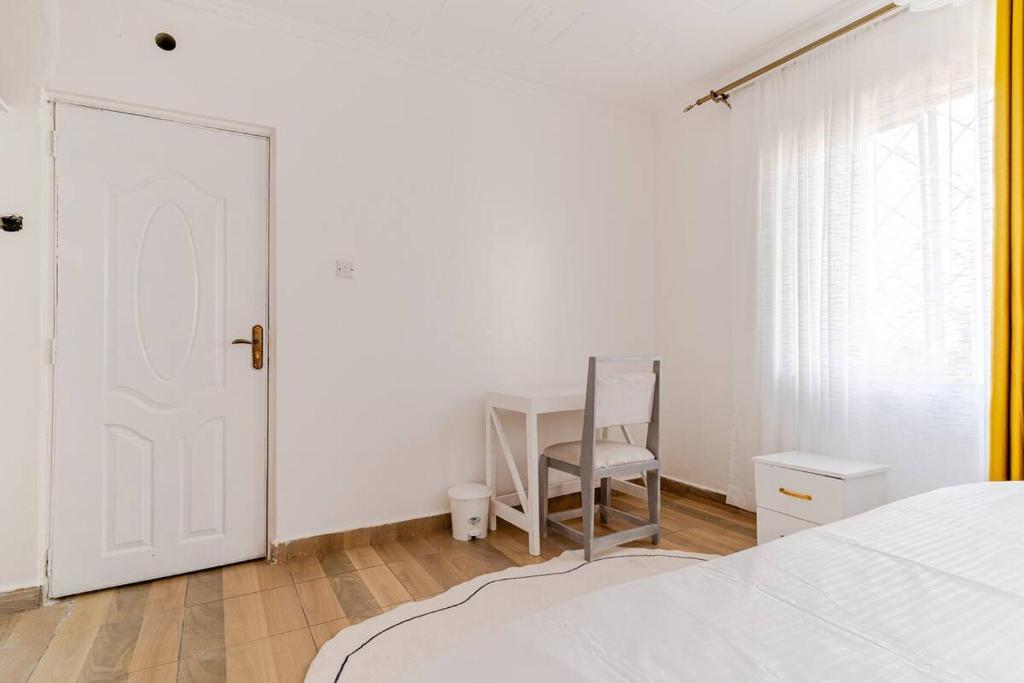 Postel nebo postele na pokoji v ubytování Saruni Homes