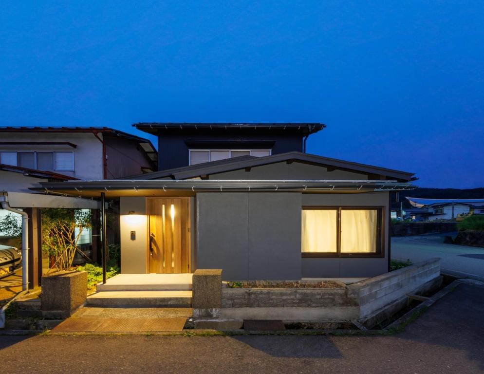 a house with a front door with lights on at villa-rizo midorigaoka - Vacation STAY 17519 in Takayama