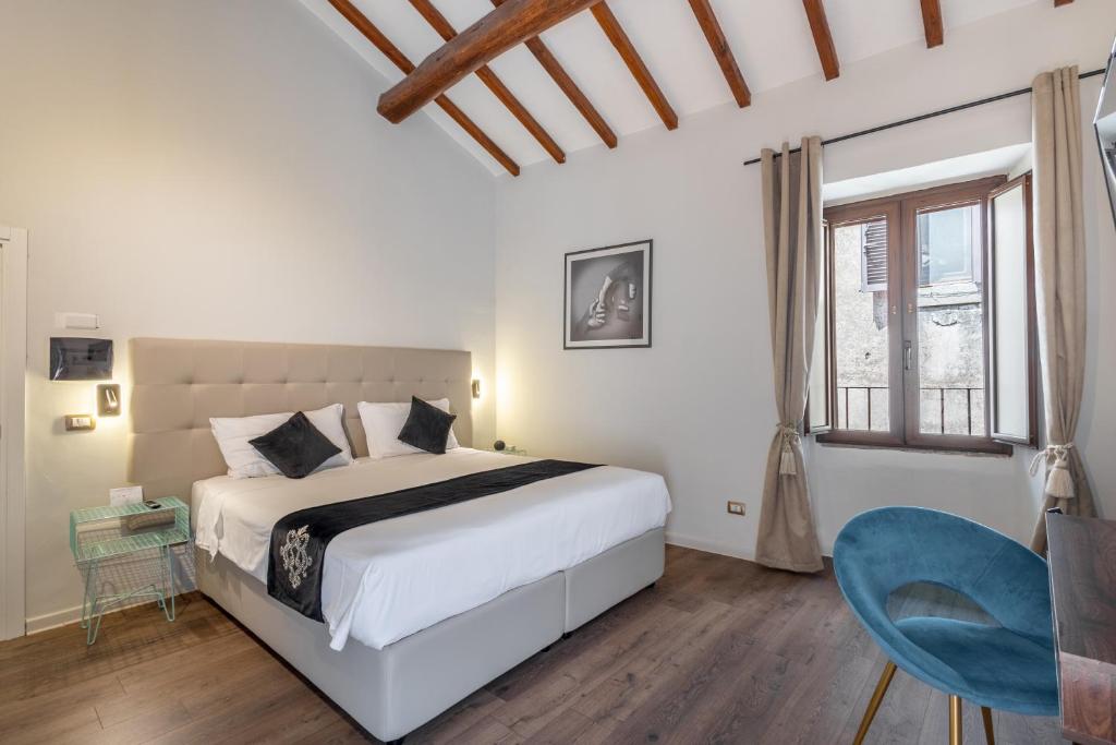 Postel nebo postele na pokoji v ubytování SOHO Piaggiarelle by Dasso - Guest House
