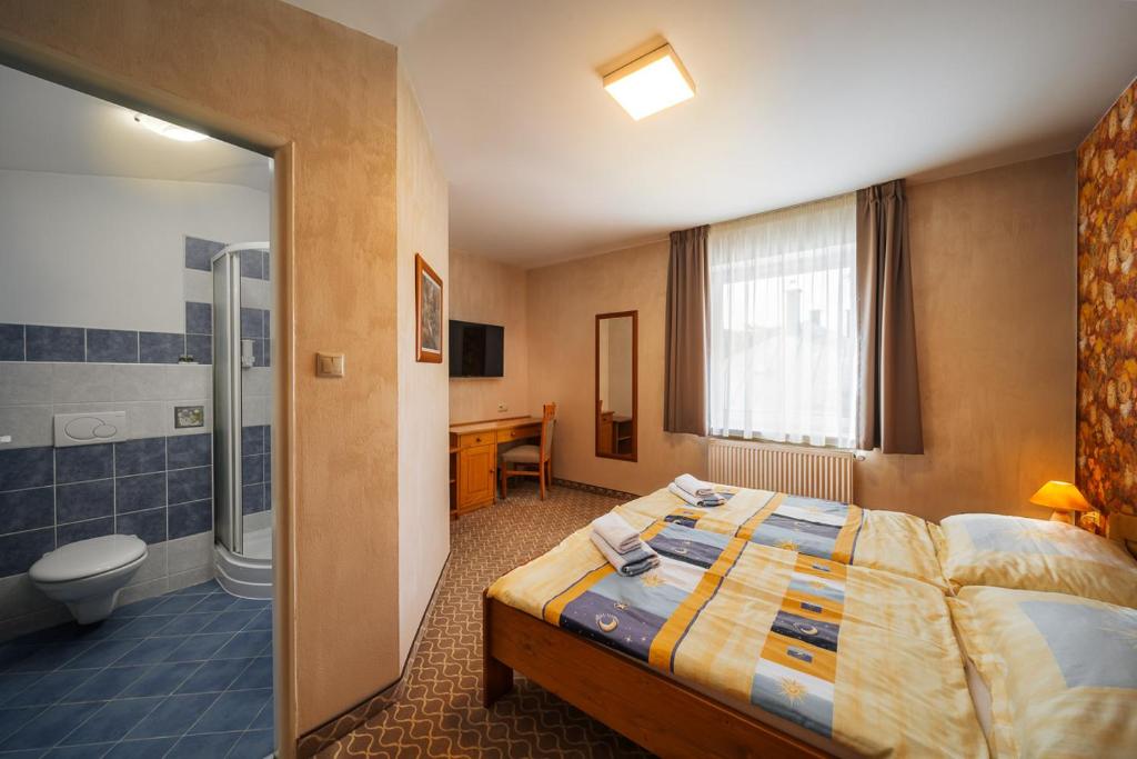 Postel nebo postele na pokoji v ubytování JazzPenzion
