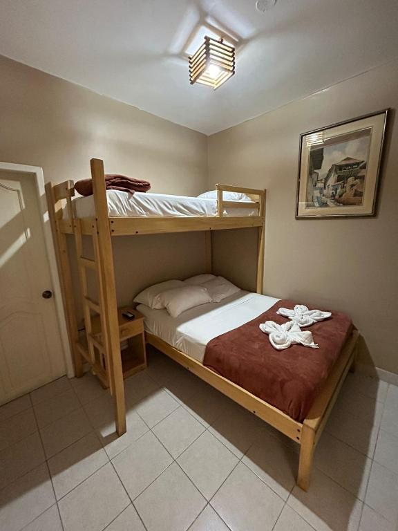 Postel nebo postele na pokoji v ubytování Chescos Hotel
