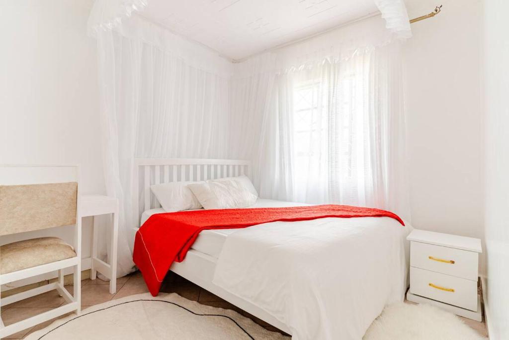 Postel nebo postele na pokoji v ubytování Saruni Homes