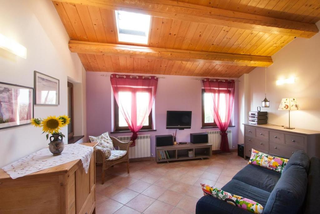 Televízia a/alebo spoločenská miestnosť v ubytovaní Casa Vacanze Angelica