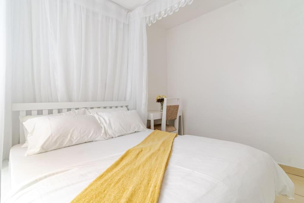 Postel nebo postele na pokoji v ubytování Saruni Homes