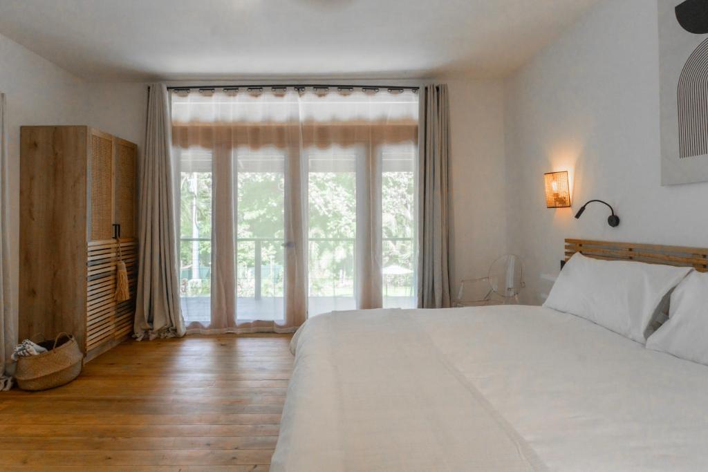 Postel nebo postele na pokoji v ubytování S Boutique Hotel