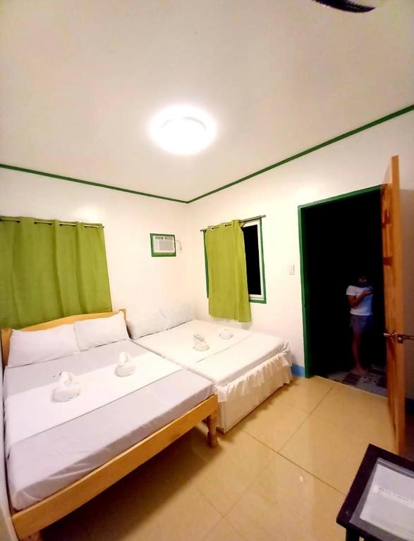 Postel nebo postele na pokoji v ubytování Domos Native Guest House