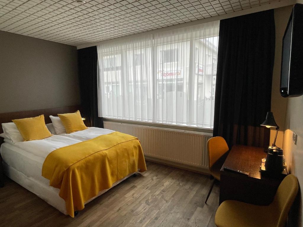 Posteľ alebo postele v izbe v ubytovaní Hotel Norðurland