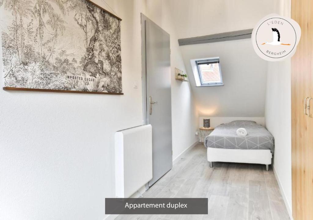 Posteľ alebo postele v izbe v ubytovaní Appartements duplex 3 et 4 personnes - Climatisation - Village élu parmi les "Plus Beaux Villages de France" - Route des Vins - Centre Alsace