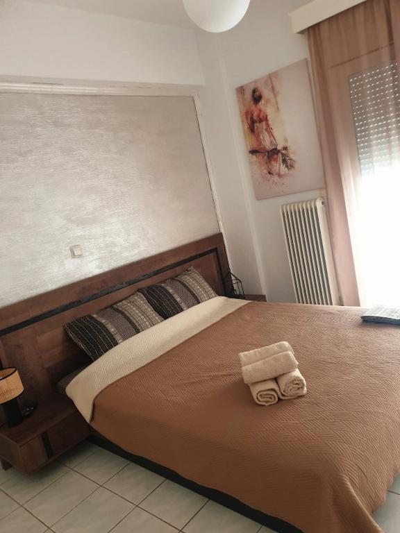 Postel nebo postele na pokoji v ubytování Άνετο και όμορφο διαμέρισμα