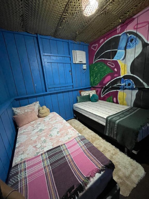 Ένα ή περισσότερα κρεβάτια σε δωμάτιο στο Hostel Casa da Cabocla