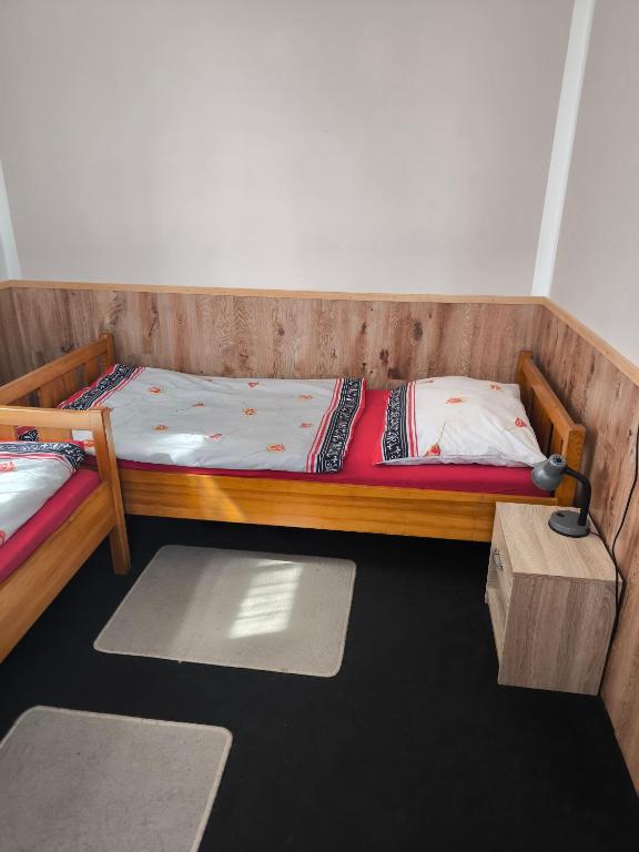 Cama o camas de una habitación en Penzion U Zeleného Stromu