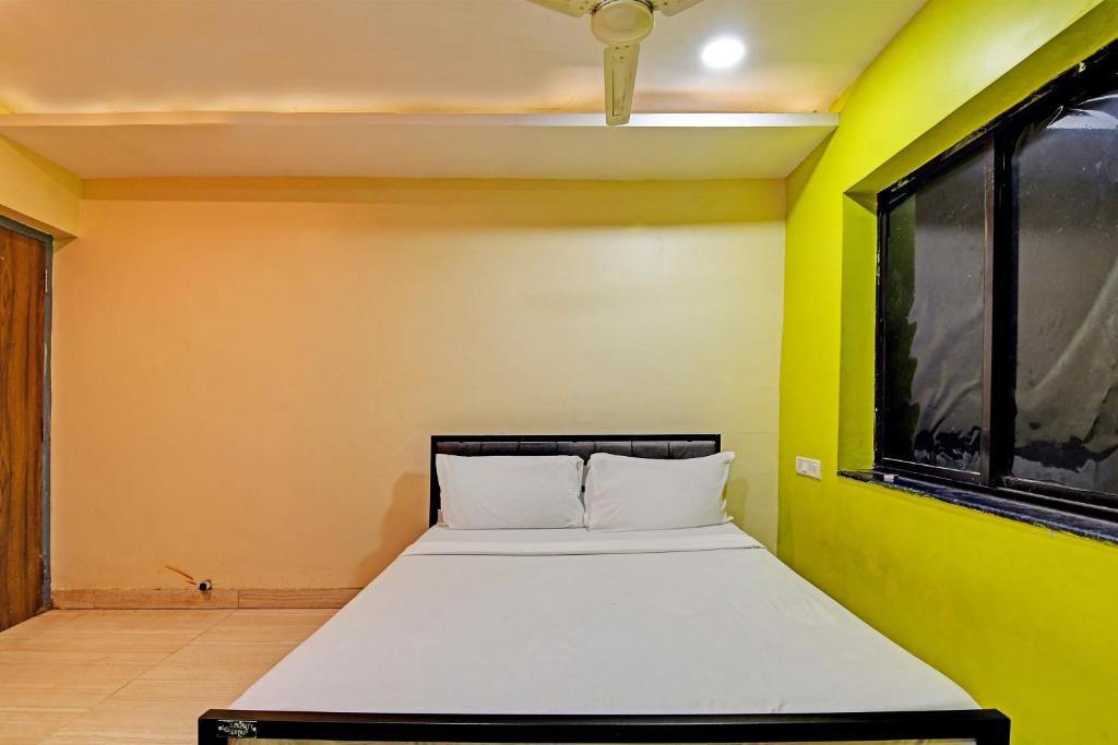Postel nebo postele na pokoji v ubytování Hotel O NANDAN